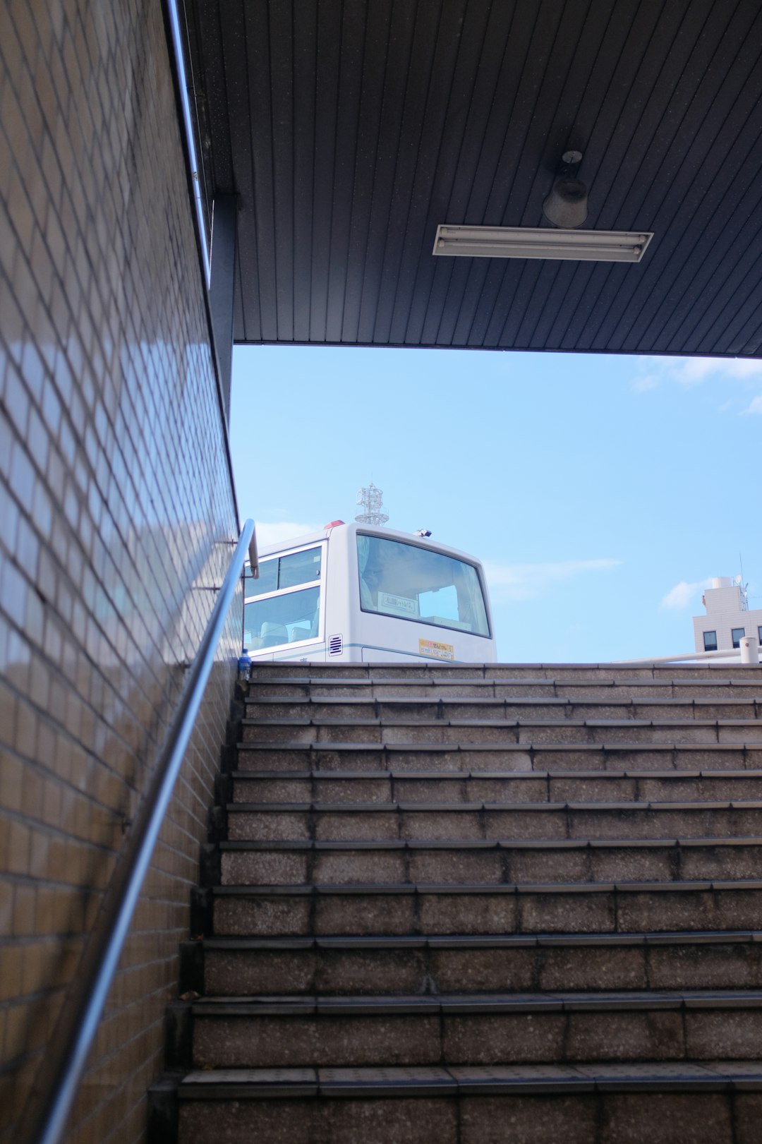 white van on gray concrete stairs during daytime