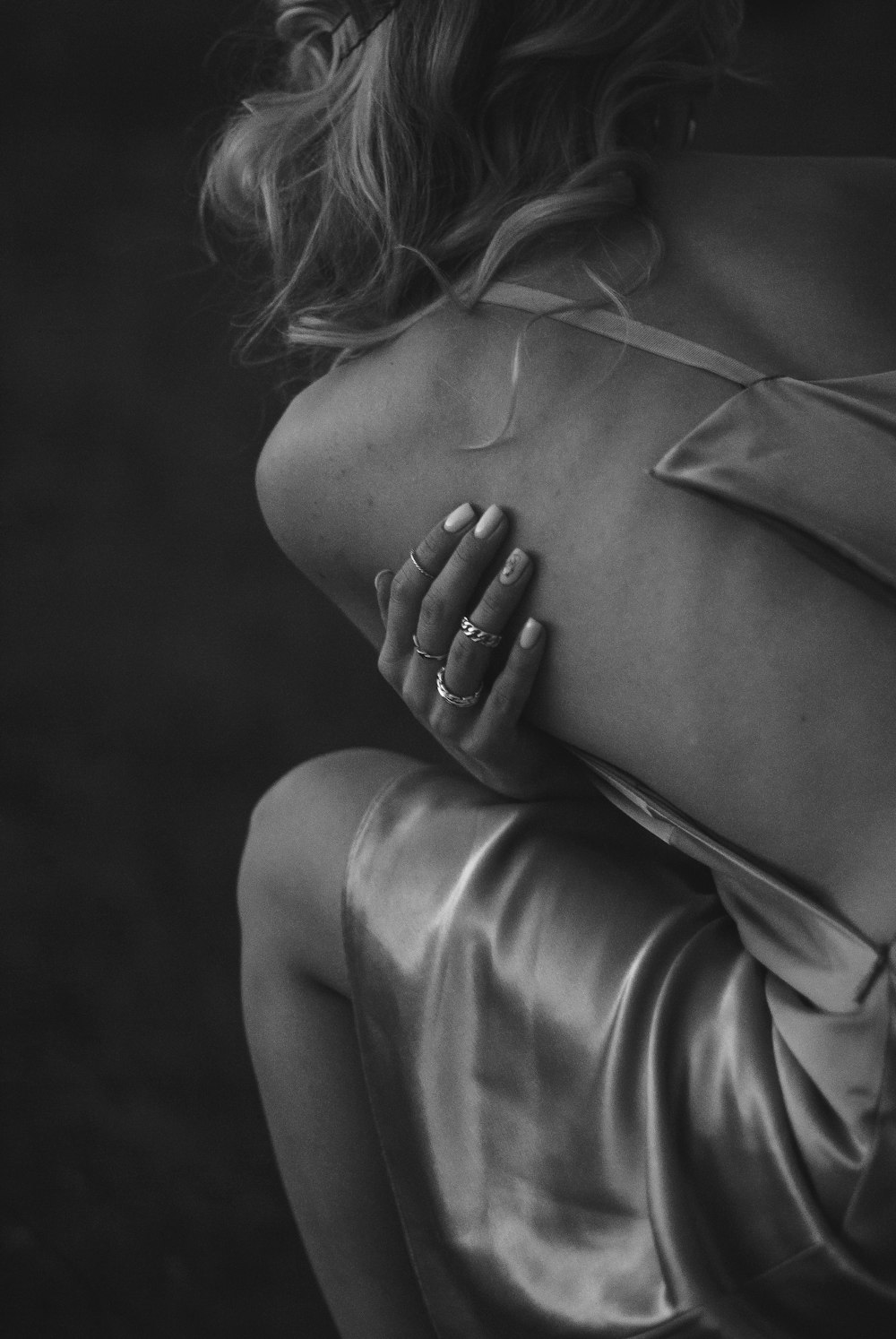 grayscale photo of woman in long sleeve shirt