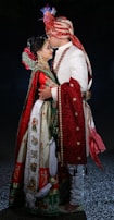 A close-up of traditional Indian wedding attire, rich in color and detail.