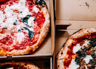 pizza on brown wooden box