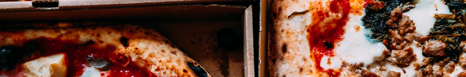 pizza on brown wooden box