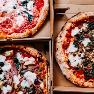 pizza on brown wooden box