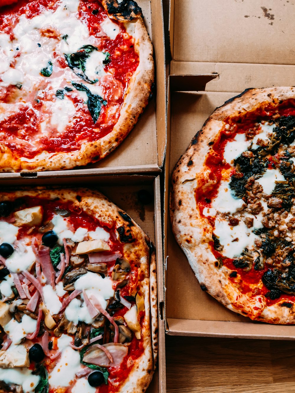 pizza on brown wooden box