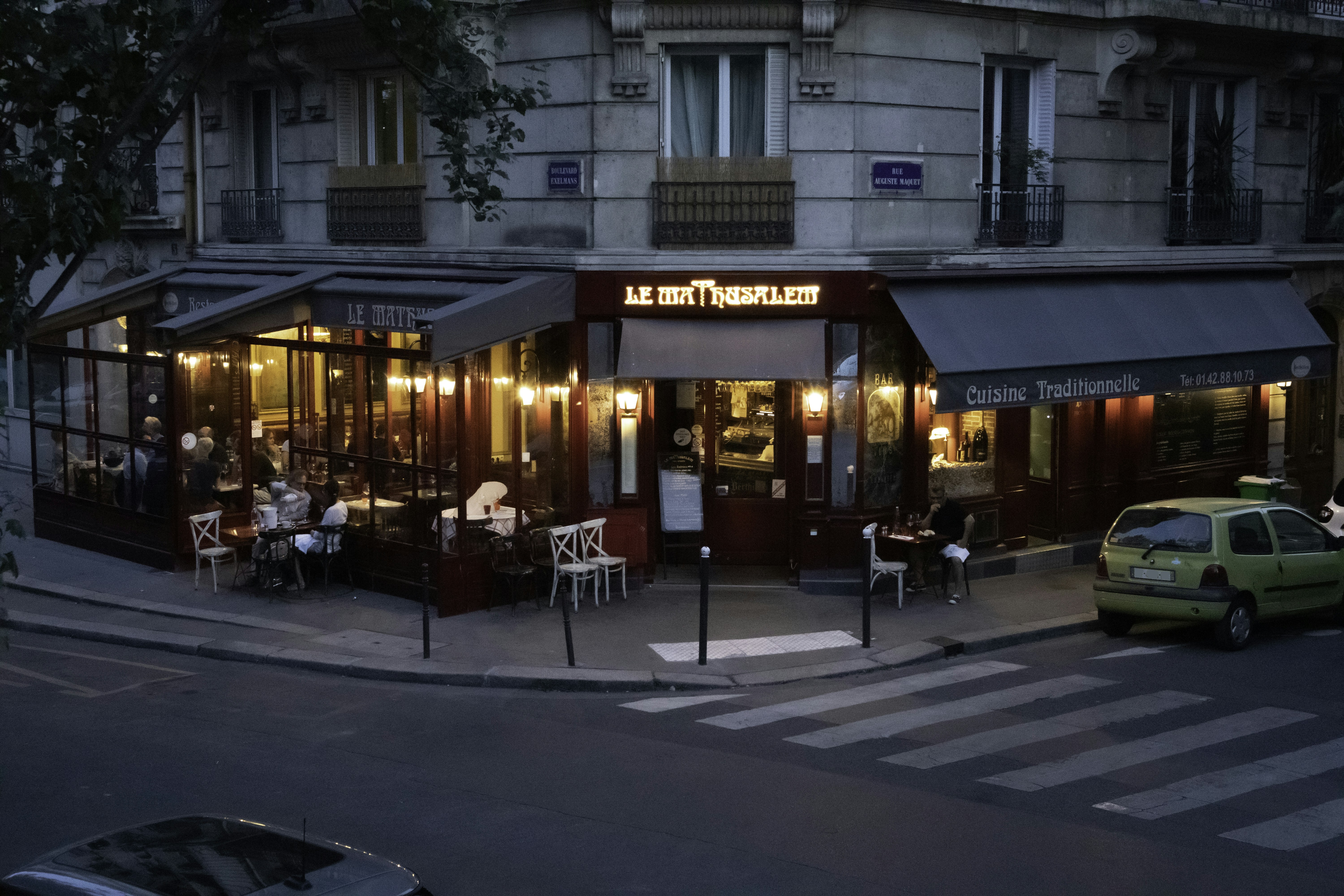 people walking on street near brown concrete building during daytime, Le mathusalem