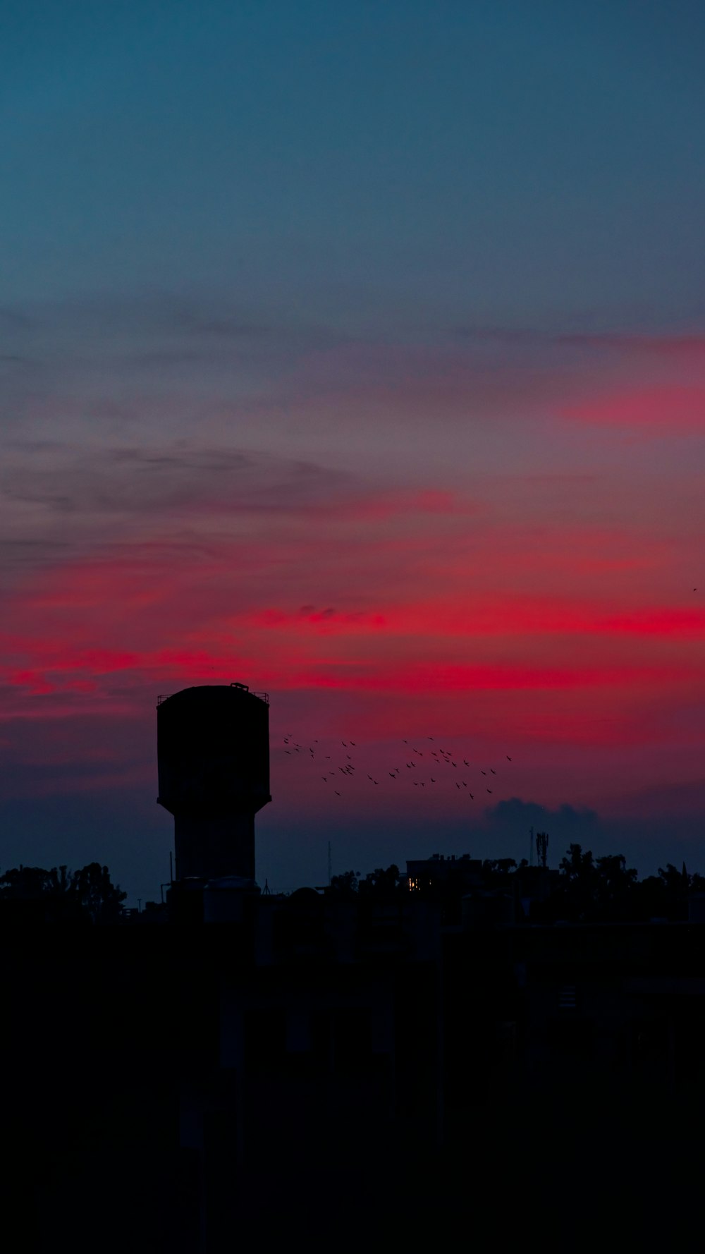 silhouette of building during sunset