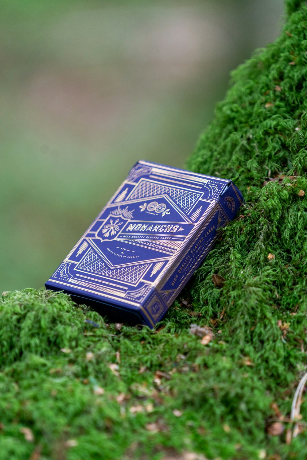 black and white book on green grass