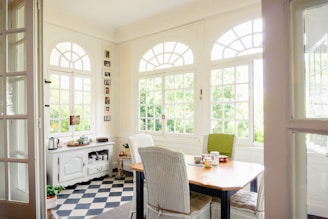 brown wooden table with chairs