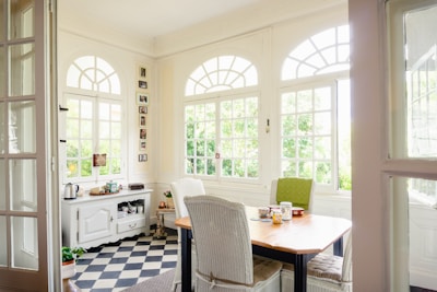 brown wooden table with chairs
