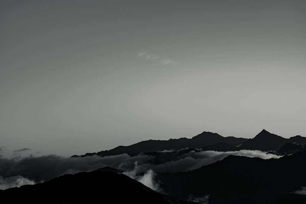 snow covered mountain under gray sky