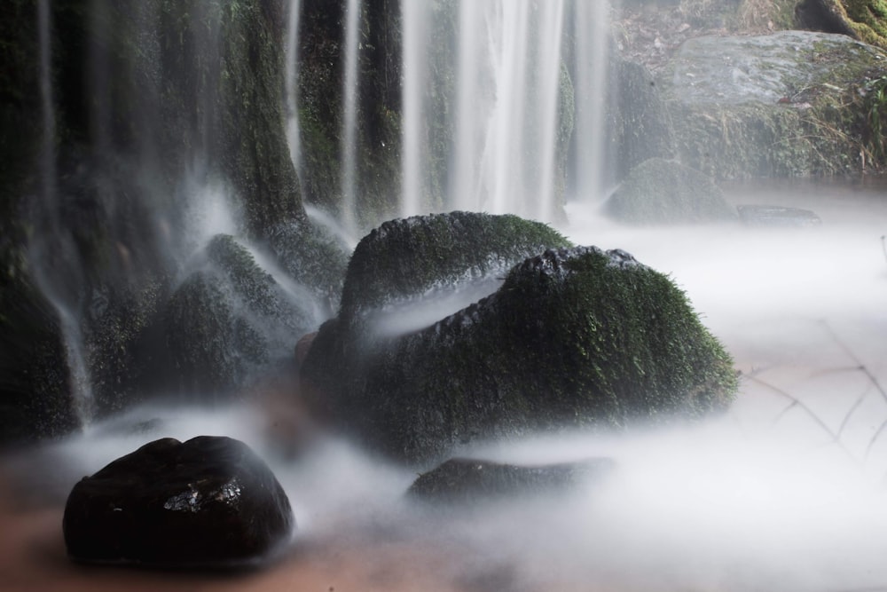 water falls on black rock