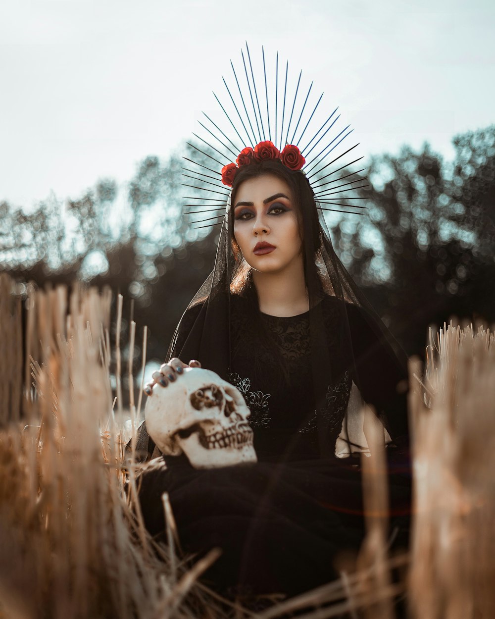 woman in black and white long sleeve shirt with red and white flower headdress