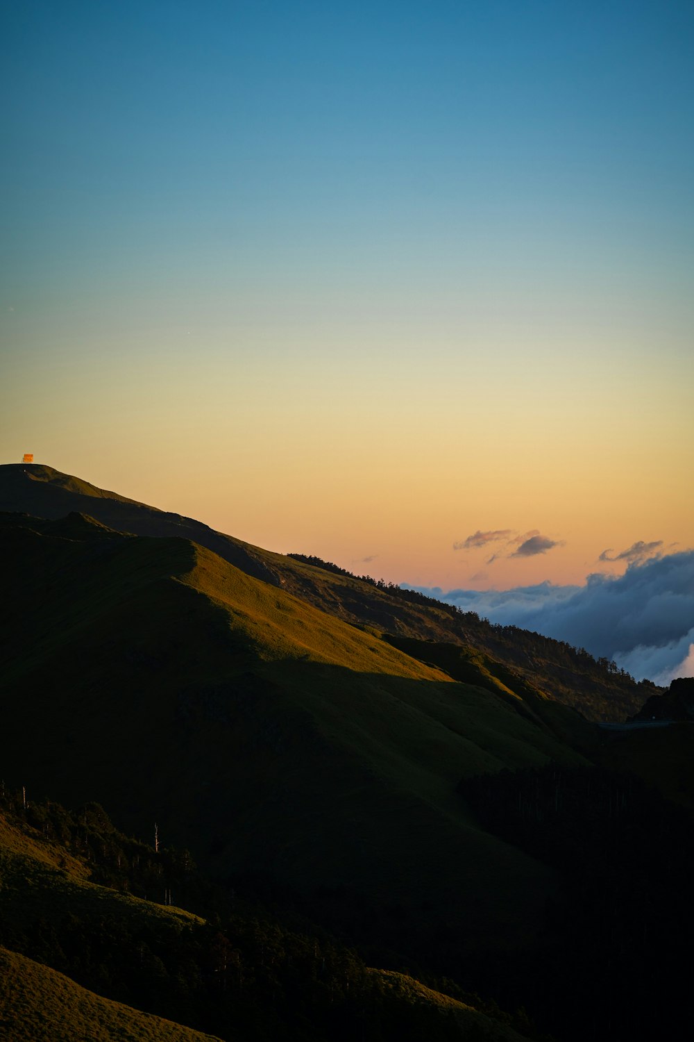 silhouette of mountain during sunset