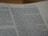 A close-up view of a page from a book featuring text written in English. The text is printed in a standard font with paragraph formatting. The page appears to have religious or formal content, as suggested by the textual arrangement and language used.