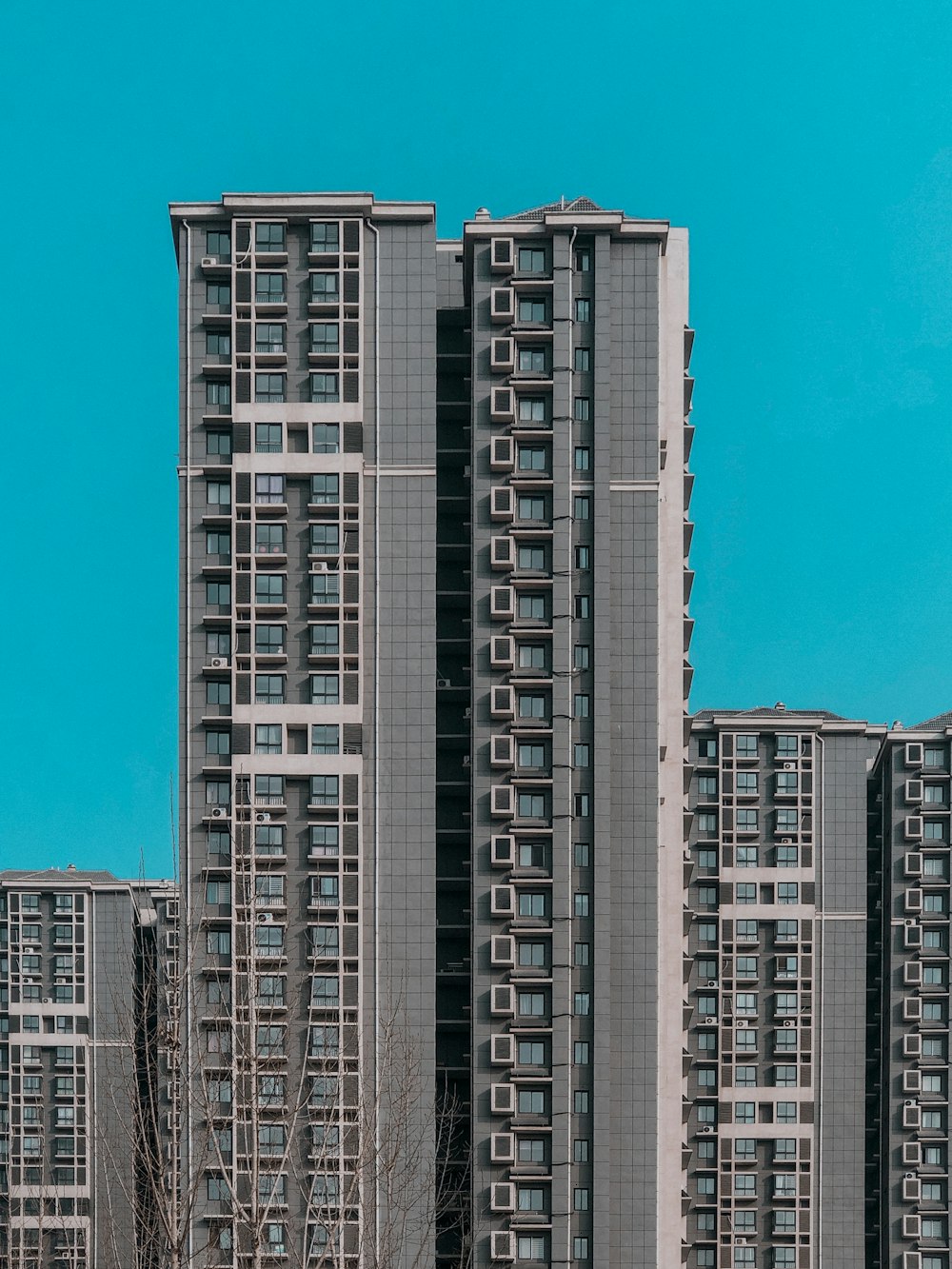 white and black concrete building under blue sky during daytime