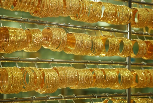 Gold bangles are on steel rock