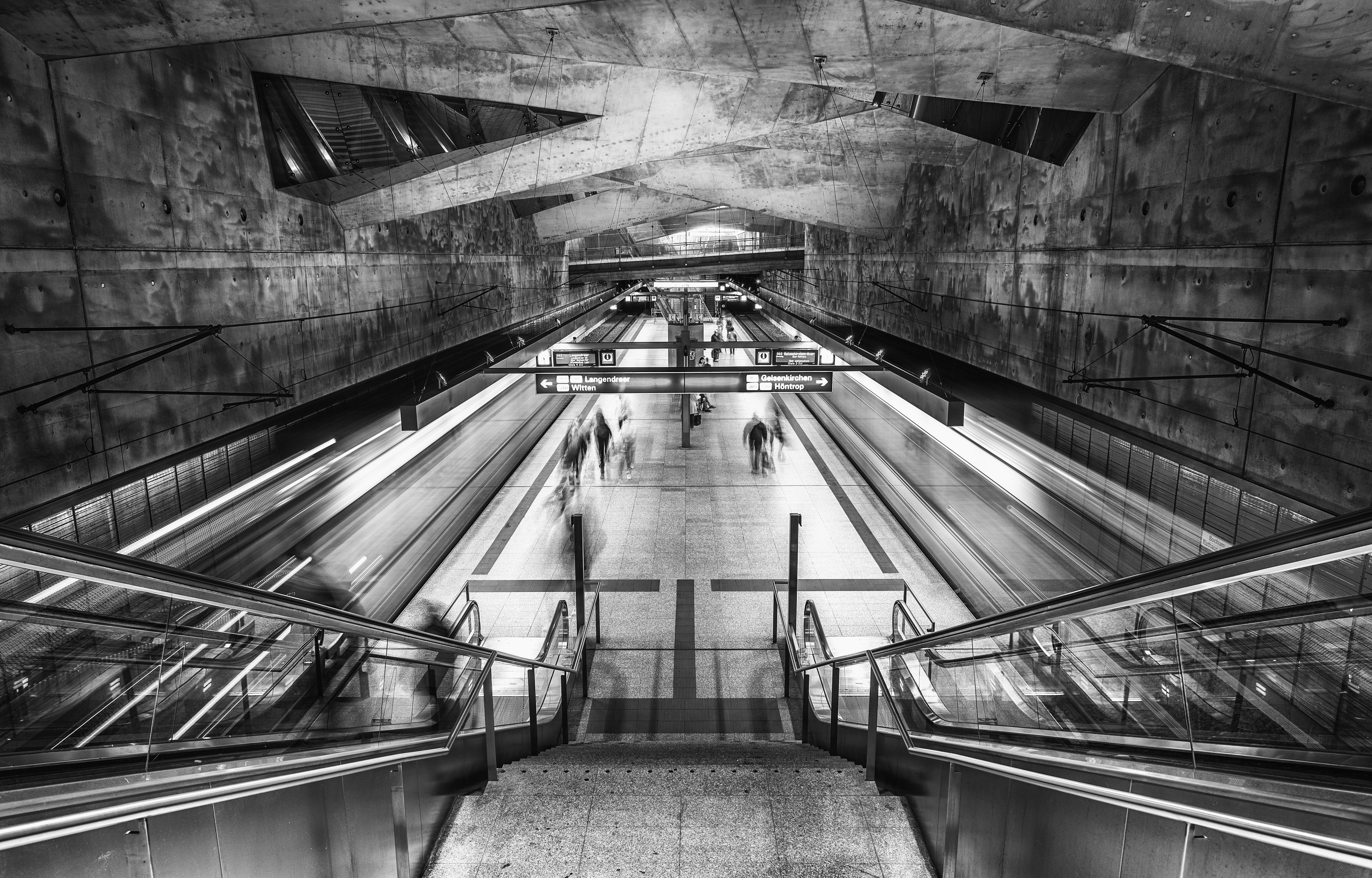 grayscale photo of a escalator