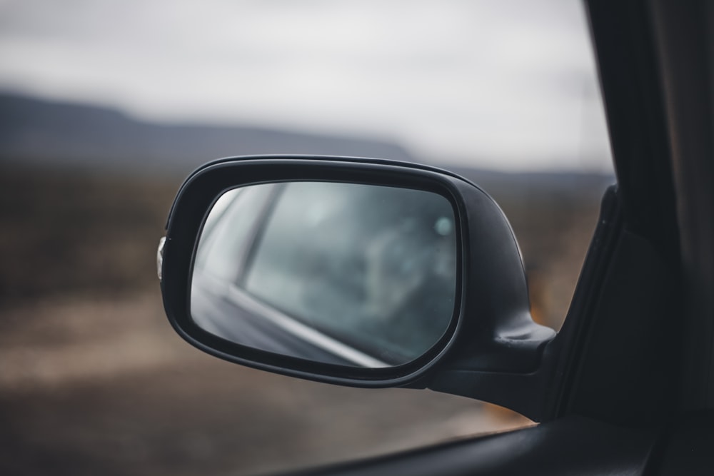 black car side mirror during daytime