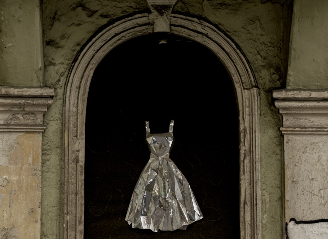woman in white dress standing on door