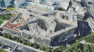 Aerial view of a contemporary building complex with sharp edges.