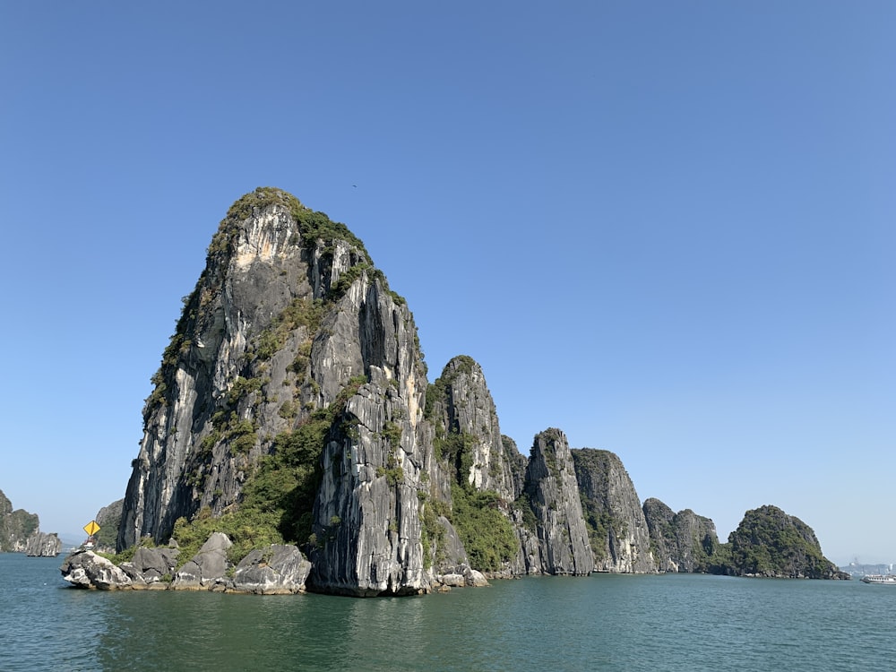 gray rock formation on sea during daytime