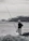 man in black jacket and white helmet fishing on sea during daytime