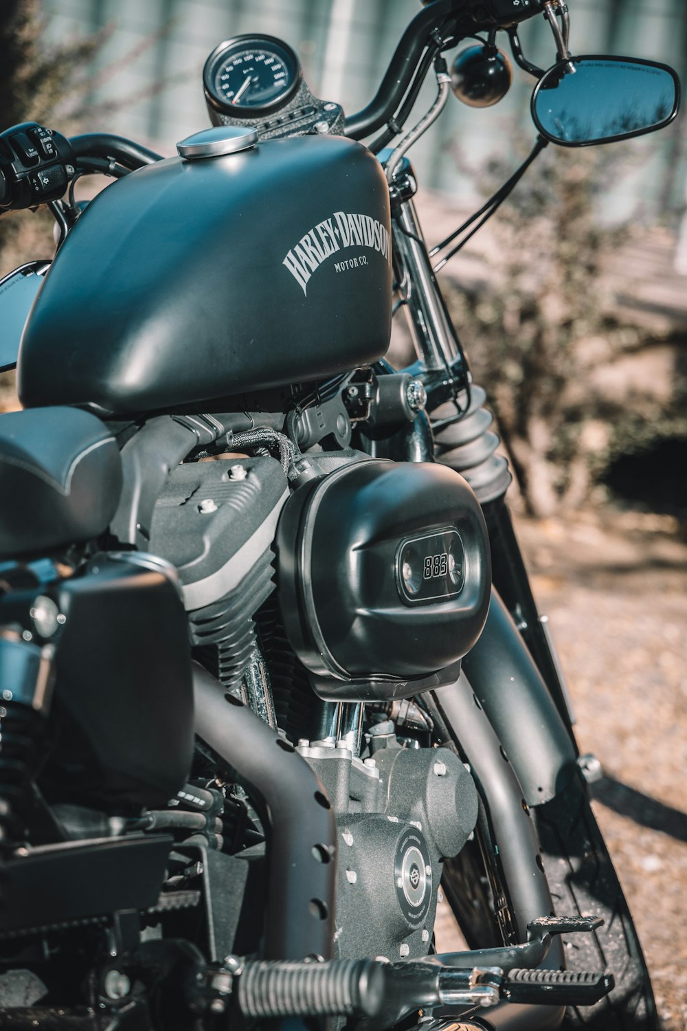 black and silver motorcycle on brown soil