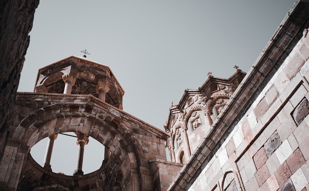 low angle photography of brown concrete building