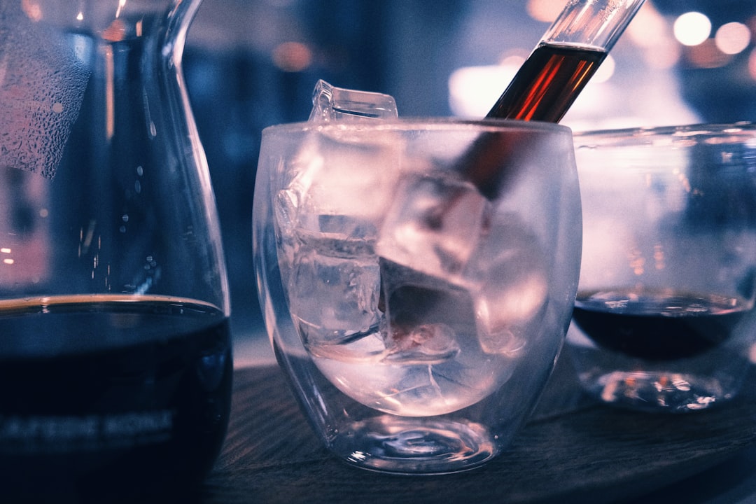 clear drinking glass with ice cubes