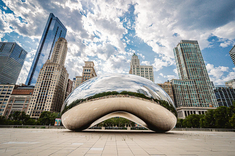 Millennium Park's Cloud Gate sculpture, known as The Bean, reflecting the Chicago skyline