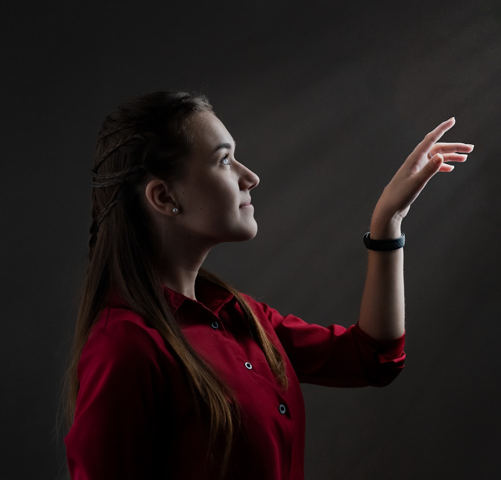 woman in red long sleeve shirt