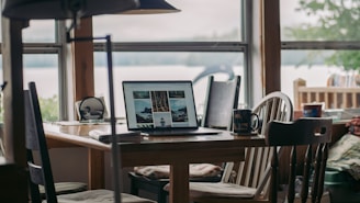 macbook pro on brown wooden table