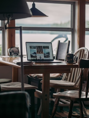 A cozy office space in Gaganger Sonamarg with travel brochures and a laptop ready for bookings.