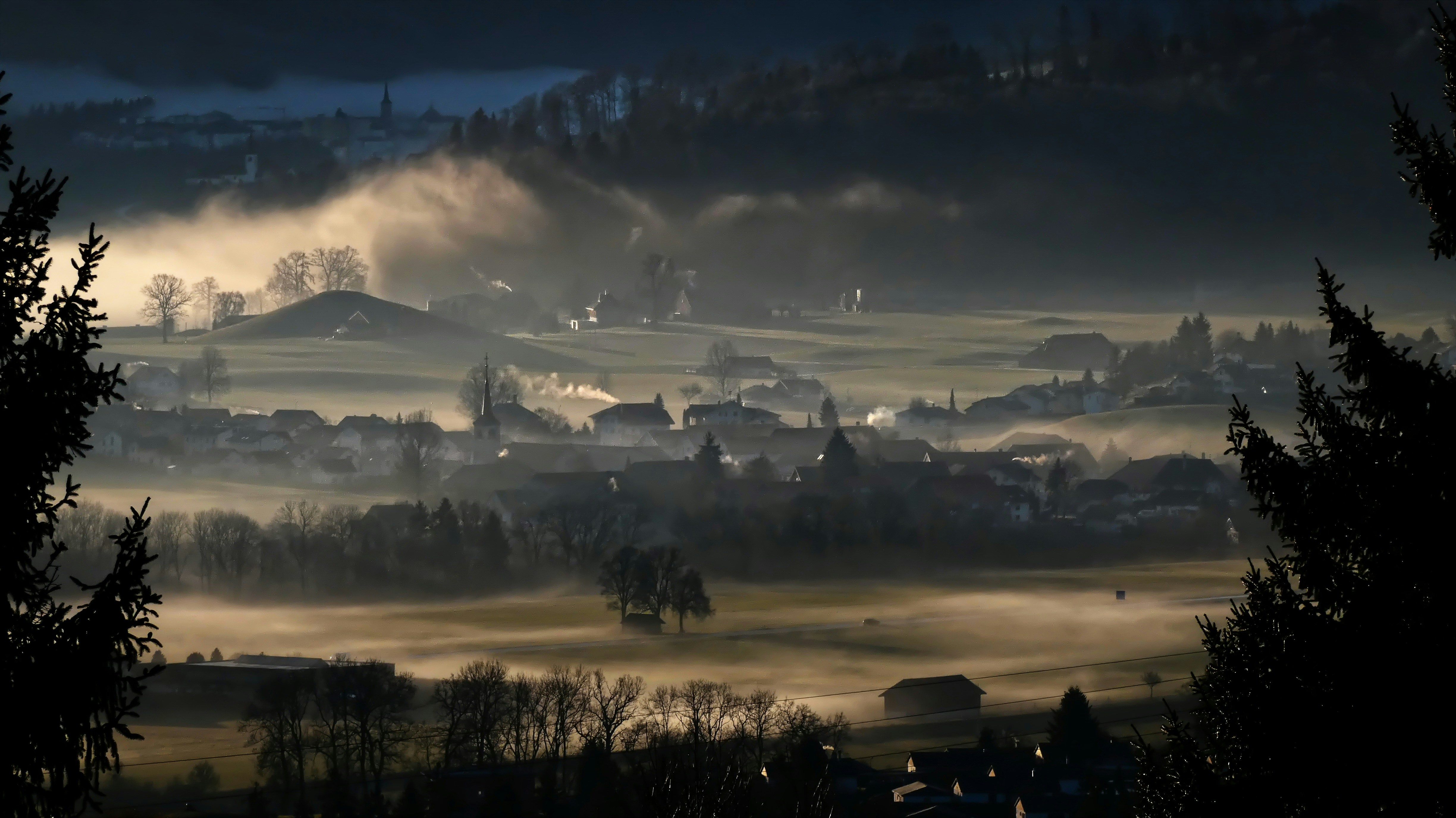 silhouette of trees and mountains during daytime, Foggy morning on Echarlens (Switzerland)