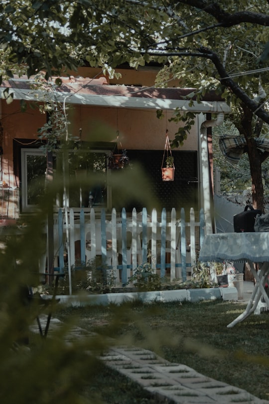 white wooden fence near green trees during daytime in Niğde Turkey