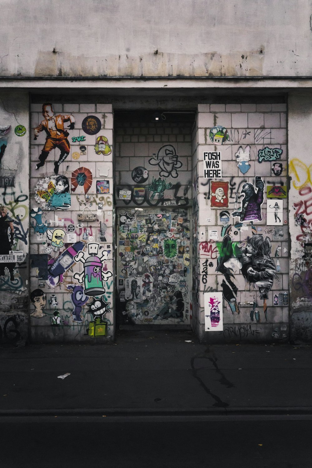 white and purple graffiti on wall