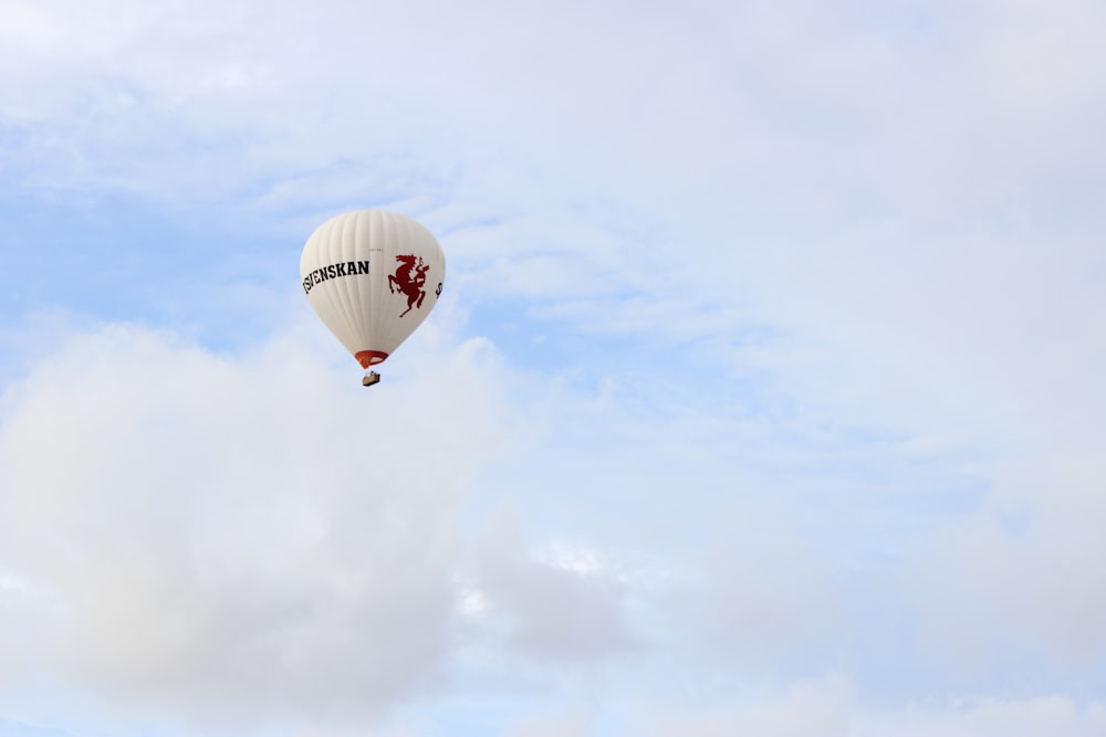 red hot air balloon in the sky