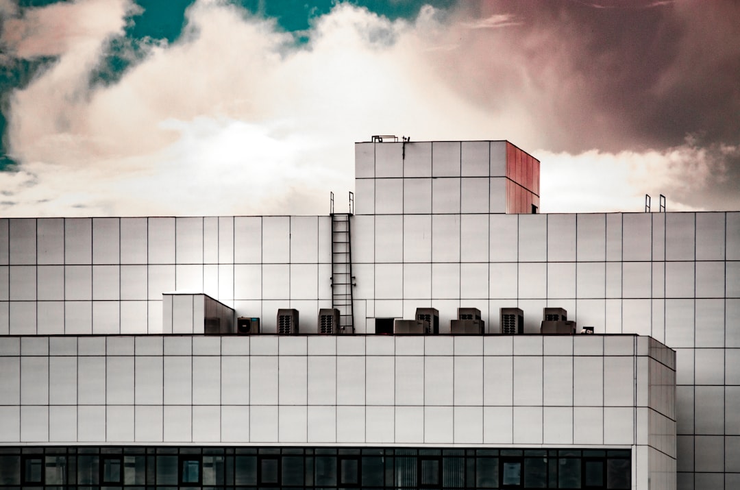 white and black building under blue sky