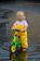 A joyful child riding a bright Terraride kids' bicycle through a sunny park.