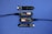 A series of electronic components displayed on a blue surface, including two black modules labeled 'Plant Wing' with colorful bar graphics and USB connectors. Two black capacitive soil moisture sensors version 1.2 are also present, with one shown connected via black cables.