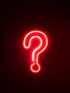 red neon question mark on wall