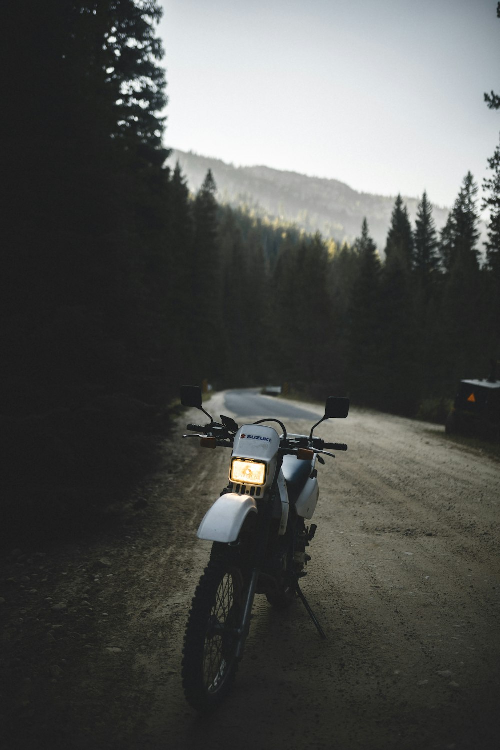 white and black motorcycle on road during daytime