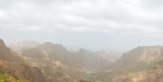 green and brown mountains under white sky during daytime in Serra da Malagueta Cape Verde
