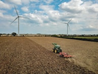 Agricultural machinery operating smoothly in a field, energized by clean solar power.
