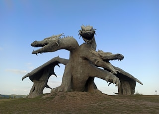 gray concrete statue under blue sky during daytime