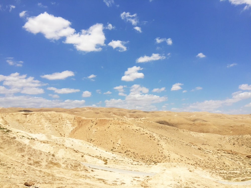 brown mountain under blue sky during daytime