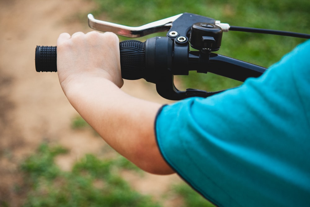 person holding black dslr camera