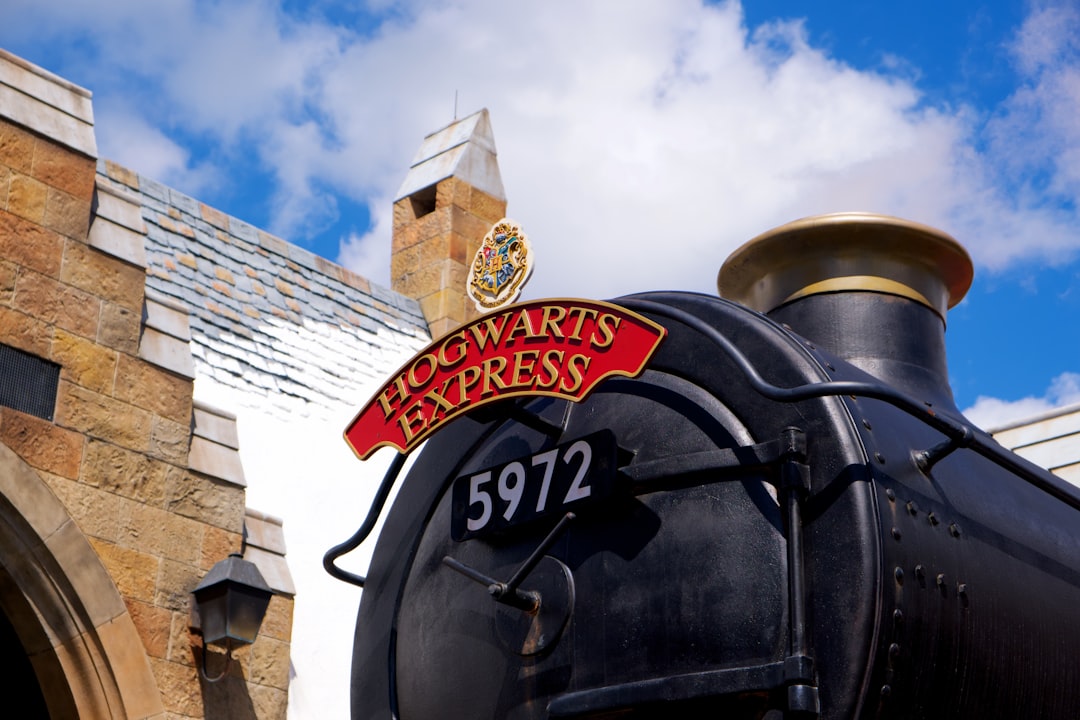 a close up of a train on a train track, Hogwarts Express pulling into Hogsmeade station – The Wizarding World of Harry Potter, Hogsmeade