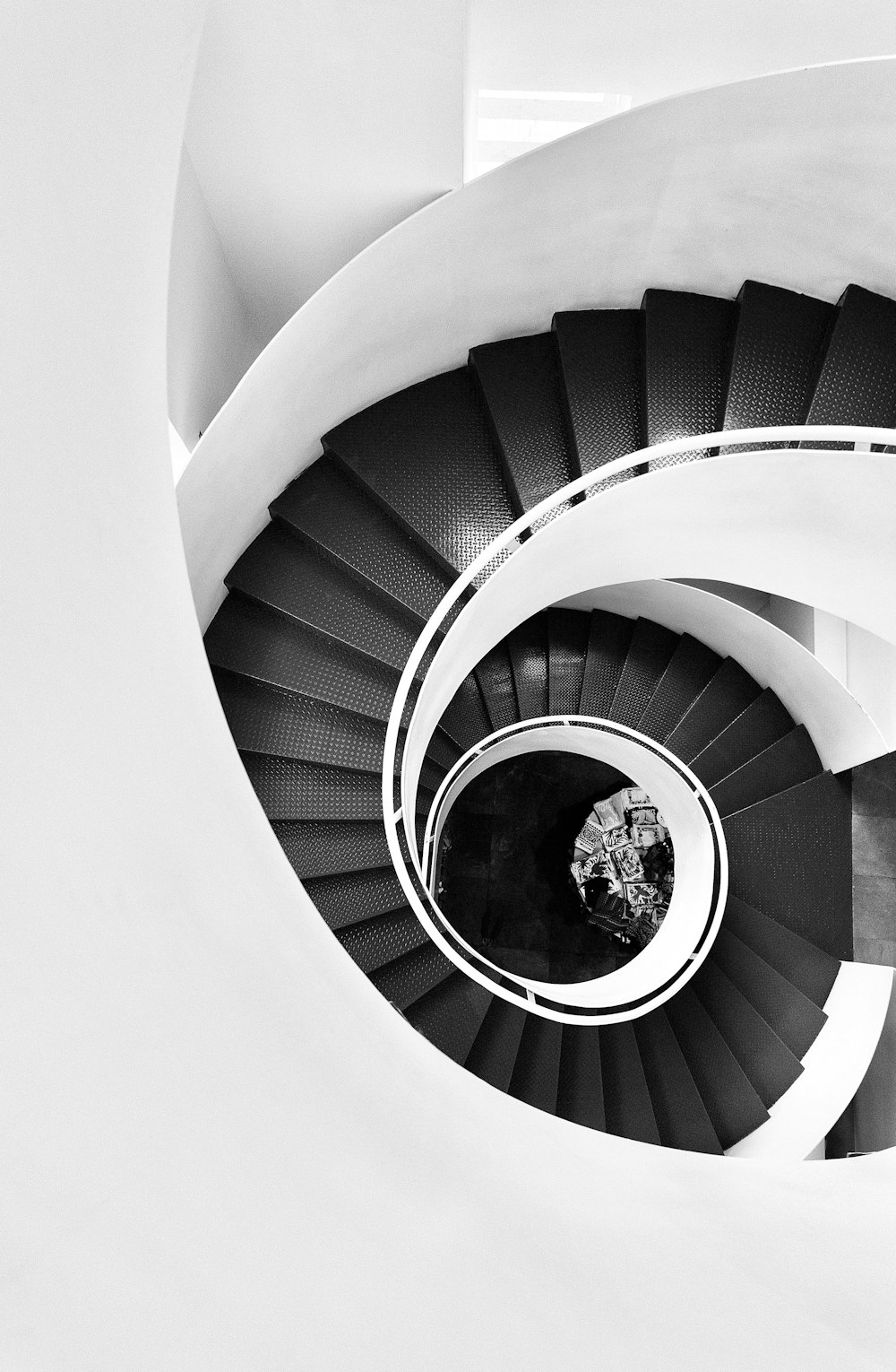 white spiral staircase with white railings