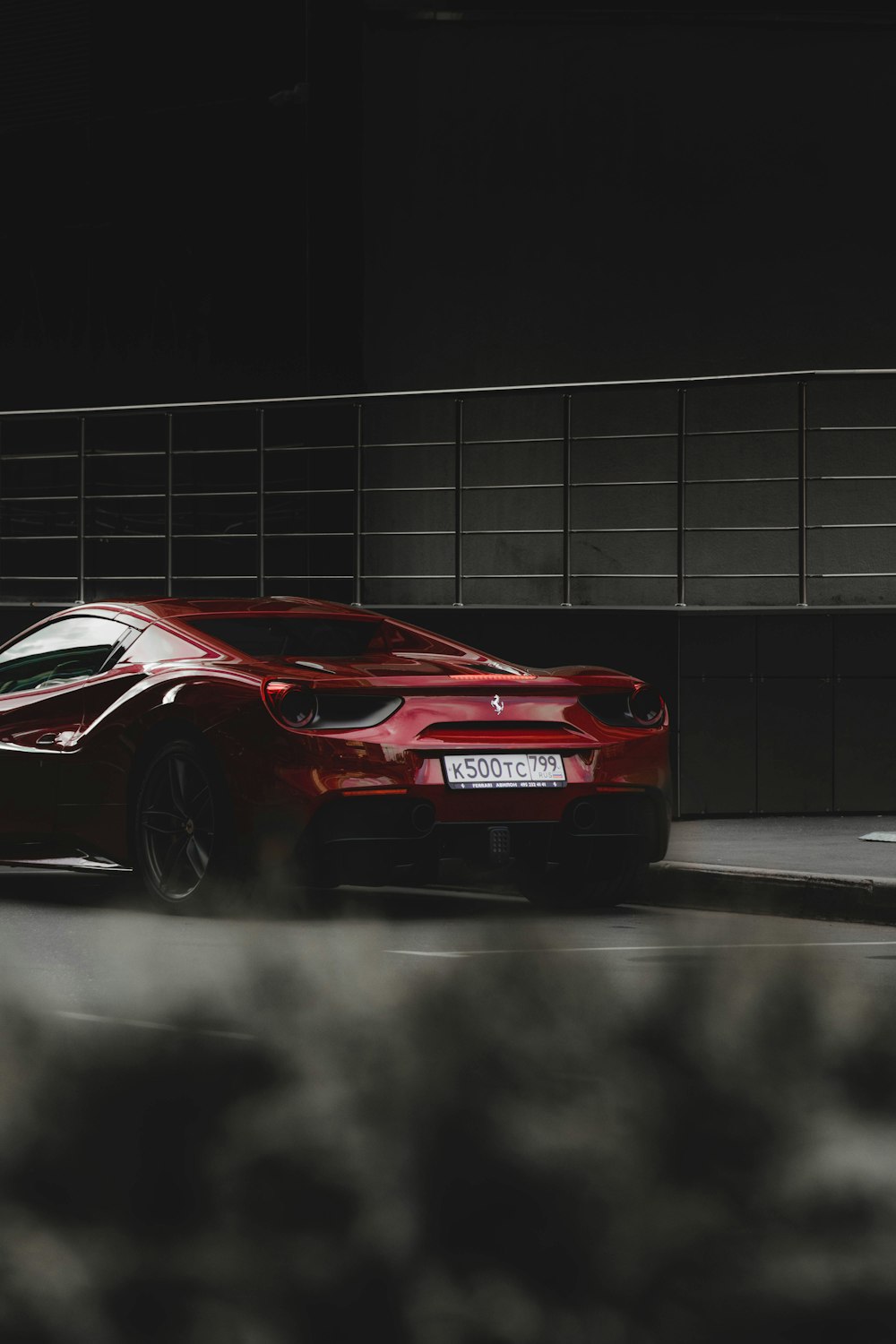 red ferrari 458 italia on gray road