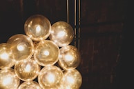 A set of smart light bulbs glowing in different colors in a cozy room.